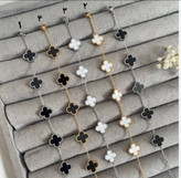 دستبند ونکلیف زنانه ی استیل به رنگ های طلایی و نقره ای با سنگ سفید و مشکی